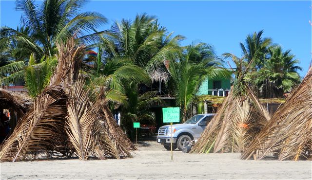 Haven't seen this on the beach before. The green sign reads "POW WOW PIZZA". That should be interesting. There was a table but no chairs inside the teepee.