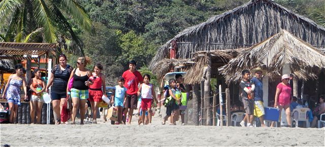 I caught this group of folks descending on the beach. IN my mind they are all saying " where should we set out stuff up:
