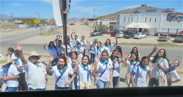 They just started smiling and waving as we passed by. Wish we could have stopped and chatted and found out what they were all about.