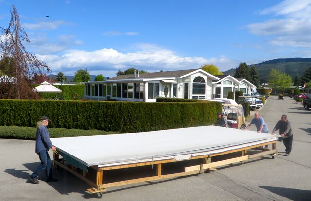 Friends of ours, just a few homes away sold their 5th wheel that came with a solid deck and roof. This is how that was transported to the new site.