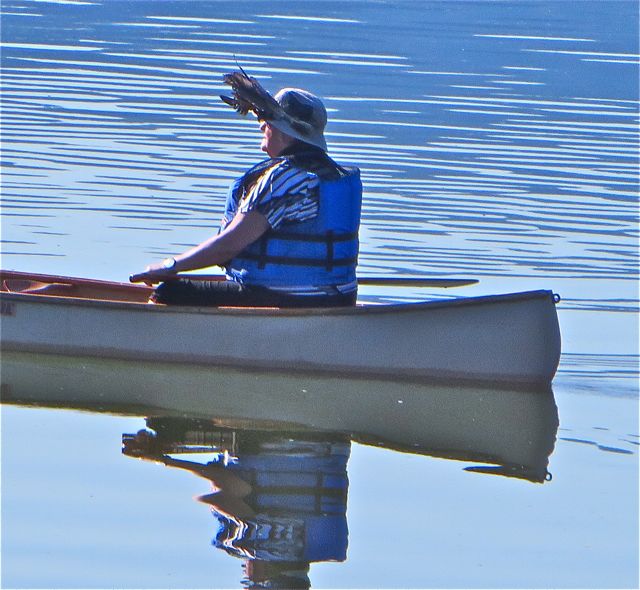 We see this couple canoeing almost weekly and each time she wears these feathers in her hat. So intringuing