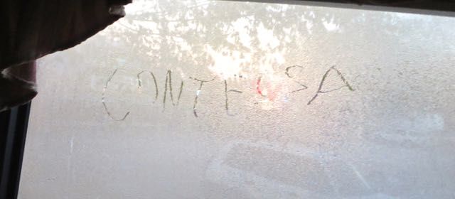 Frost on the inside of the head of the bed window. Colin wrote my name on the window while lying in bed.