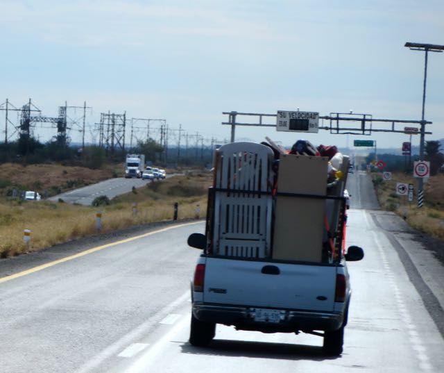 Saw this guy a few times through the day but never got a side shot of his truck. Basically he has put high things along the outside edge such as the chaise longue on the back left all the way around and just piled stuff in the middle. I give him a gold star for creativity. How else would he have got so much stuff in his truck.