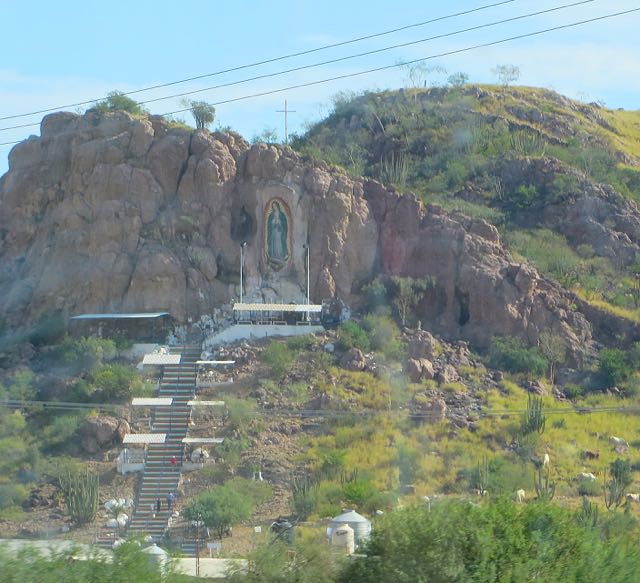 Just after Obregon there is a tribute on the hill to the Virgen de Guadalupe. I continue to be impressed at the detailed photos that my camera produces from a fast moving vehicle. You can actually see pilgrims climbing the steps.