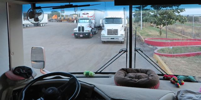 Our first choice was were the truck on the right was parked but facing the other direction. That was so we could put our bedroom slide out plus the grass for the girls was perfect. However we soon realized that we could easily be boxed in.