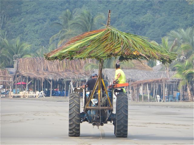 Someone is making these small round palapas and transporting them to a few