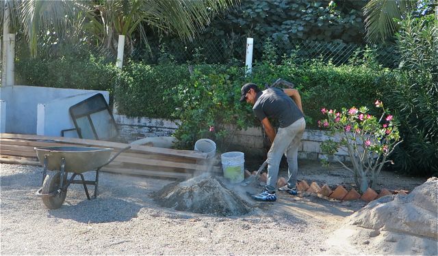 Meanwhile back at our site it was time to star mixing the cement...the old fashion way.