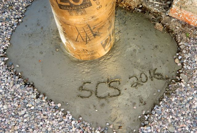 The post to the right of this also has the 5C's written in the cement but not the date of 2011.