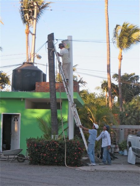 More 'concrete' being poured but not for us. The RV park is putting in the white tube to hold up the electrical lines. The tree on the left did the job until it was hit by lightening a few years ago and it is about to fall over.