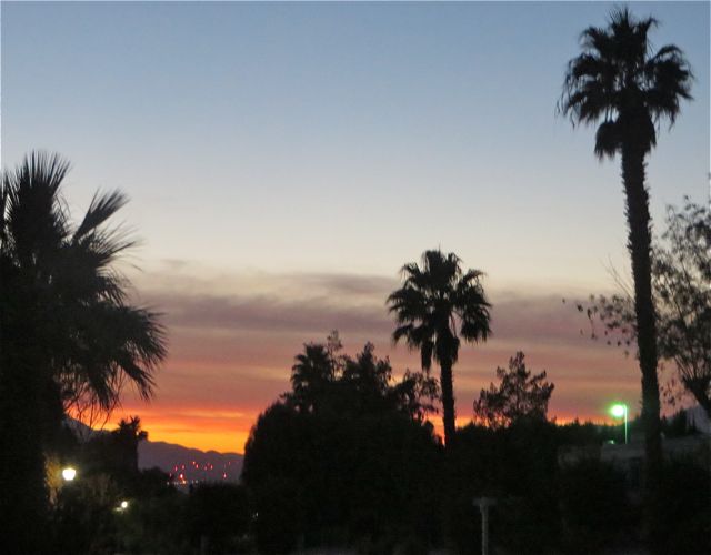 Great sunset last night. We have no idea what all those tiny red lights are in the bottom left. We suspect that they might be red lites atop the many windmils that are in front of the Palm Springs airport runway.
